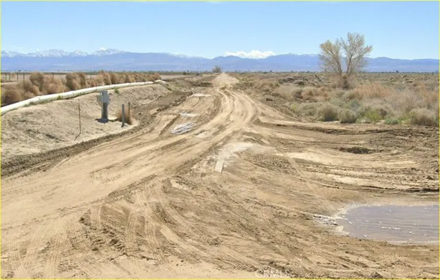 a view of mountain with a lake