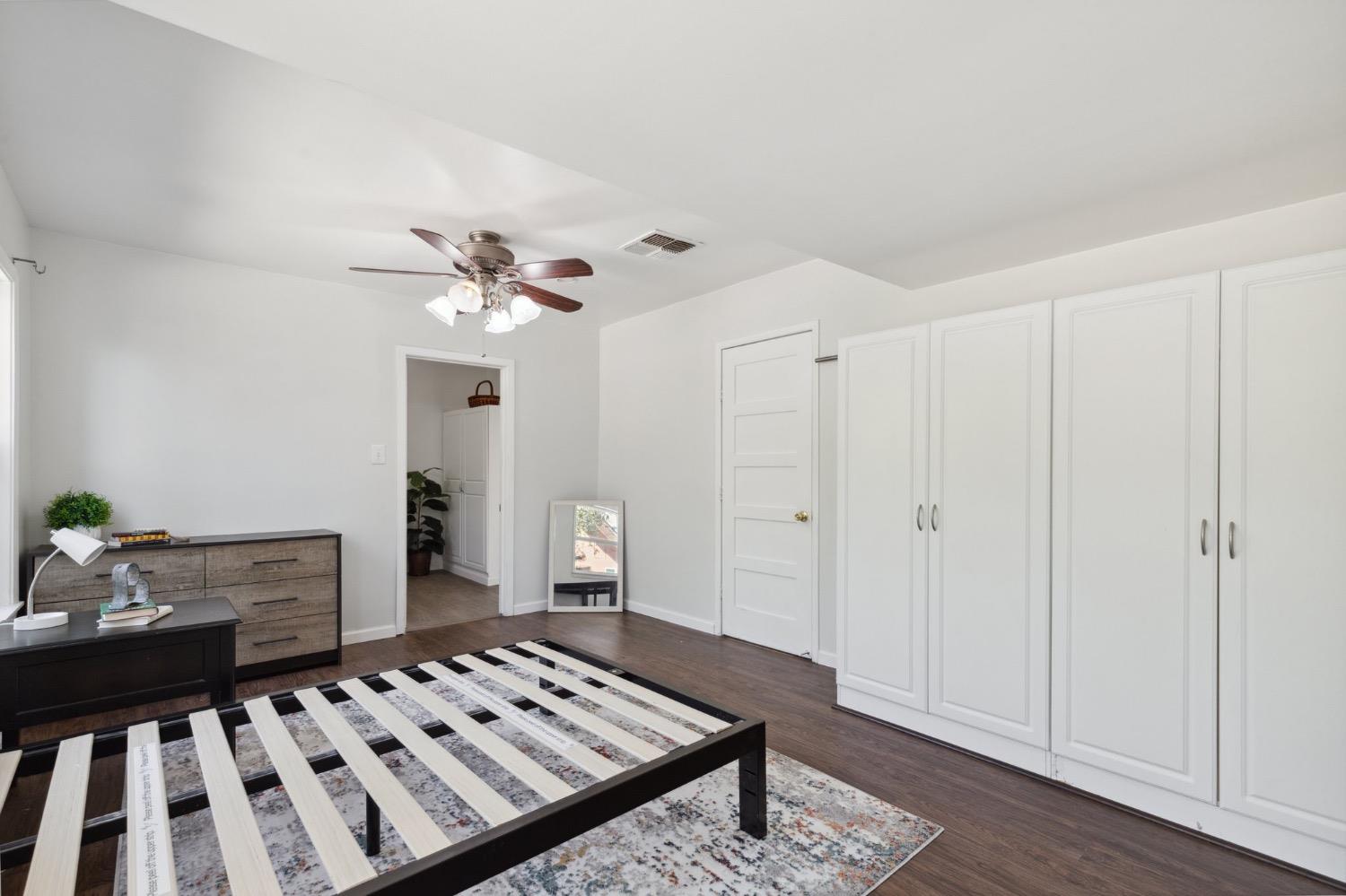 220 Sunnyside Avenue Clovis, CA 93612 - Photo 17 of 38 a view of a livingroom with furniture and wooden floor