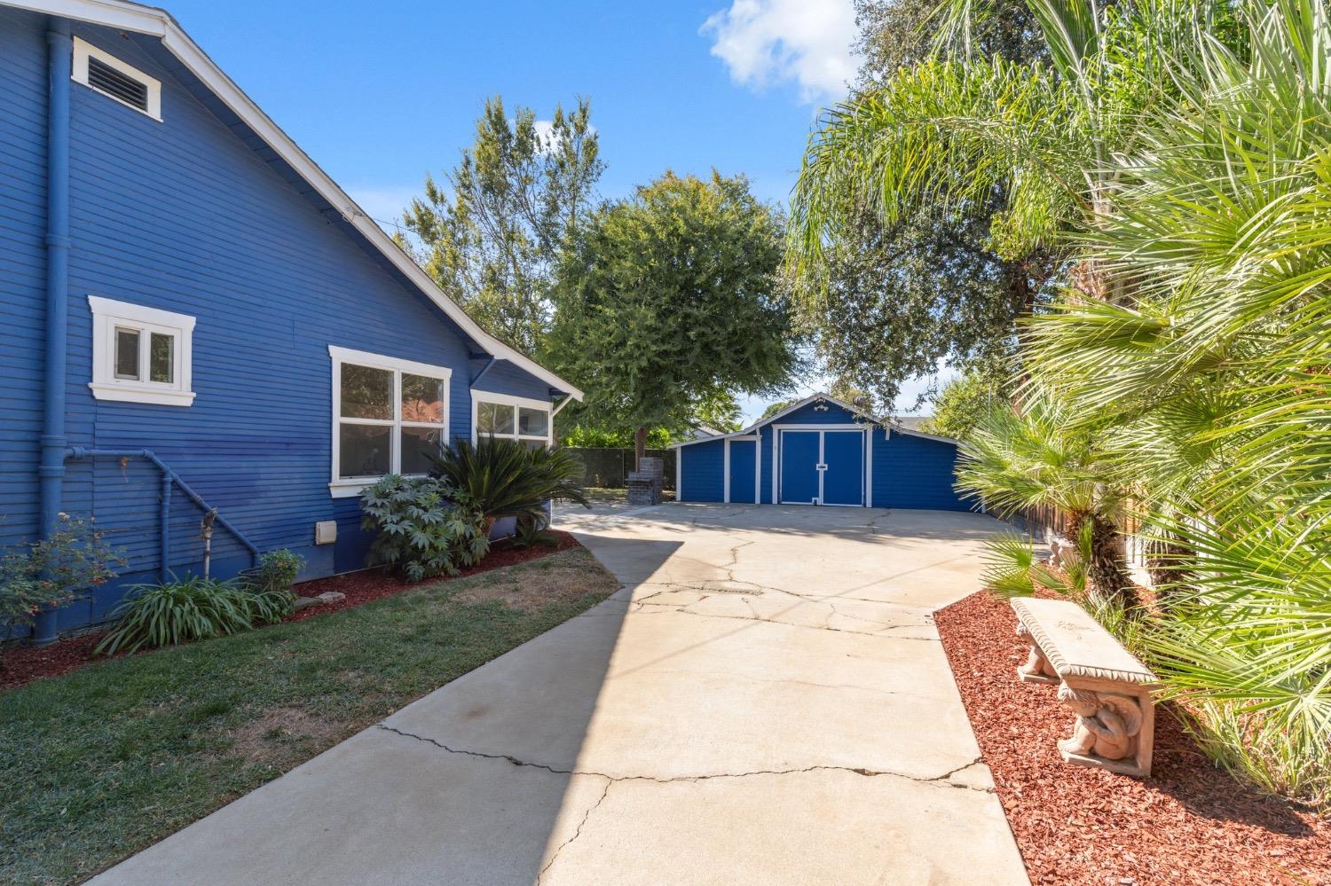 220 Sunnyside Avenue Clovis, CA 93612 - Photo 23 of 38 a front view of a house with yard