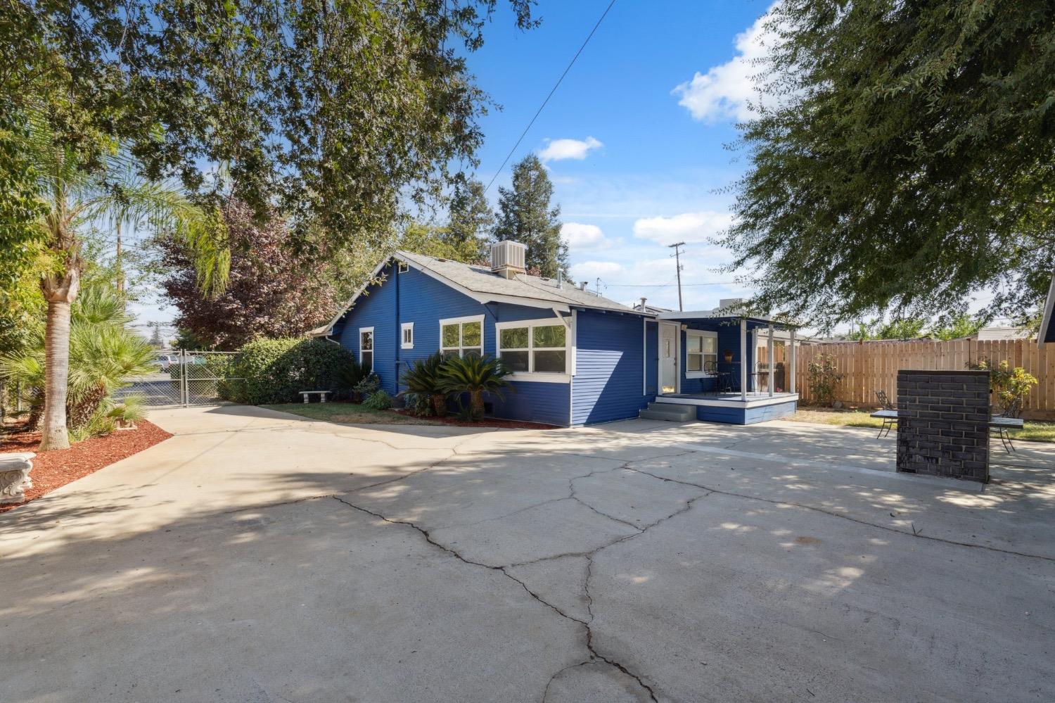 220 Sunnyside Avenue Clovis, CA 93612 - Photo 24 of 38 a front view of a house with a yard and garage
