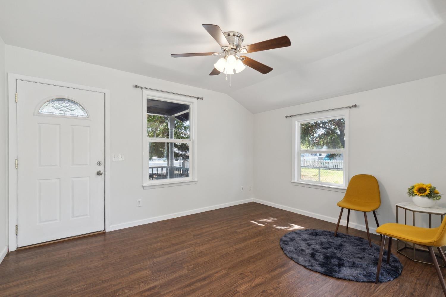 220 Sunnyside Avenue Clovis, CA 93612 - Photo 8 of 38 a living room with wooden floor and a window