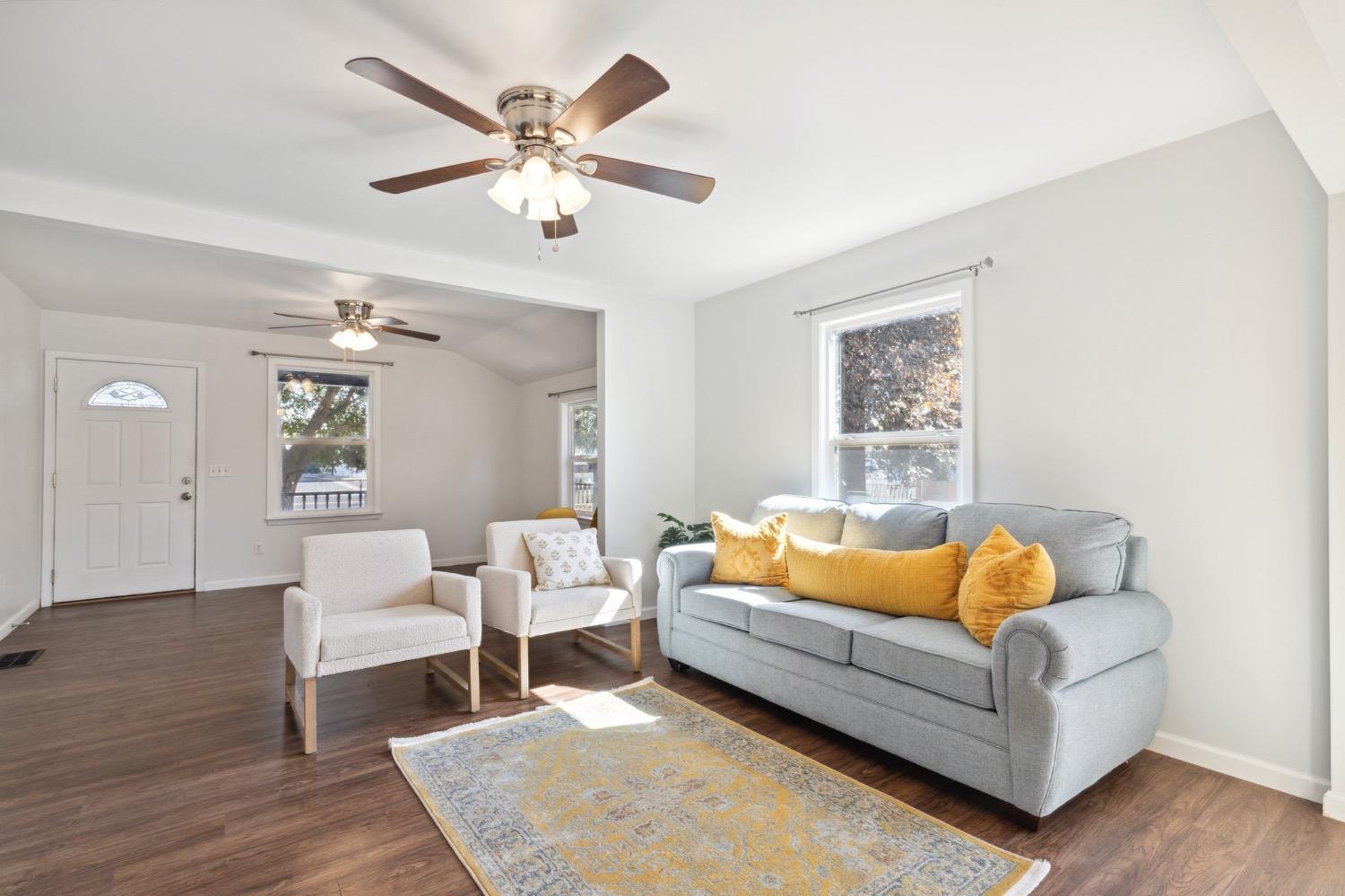 220 Sunnyside Avenue Clovis, CA 93612 - Photo 10 of 38 a living room with furniture and a rug