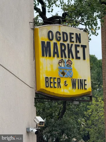 a sign that is on a brick wall