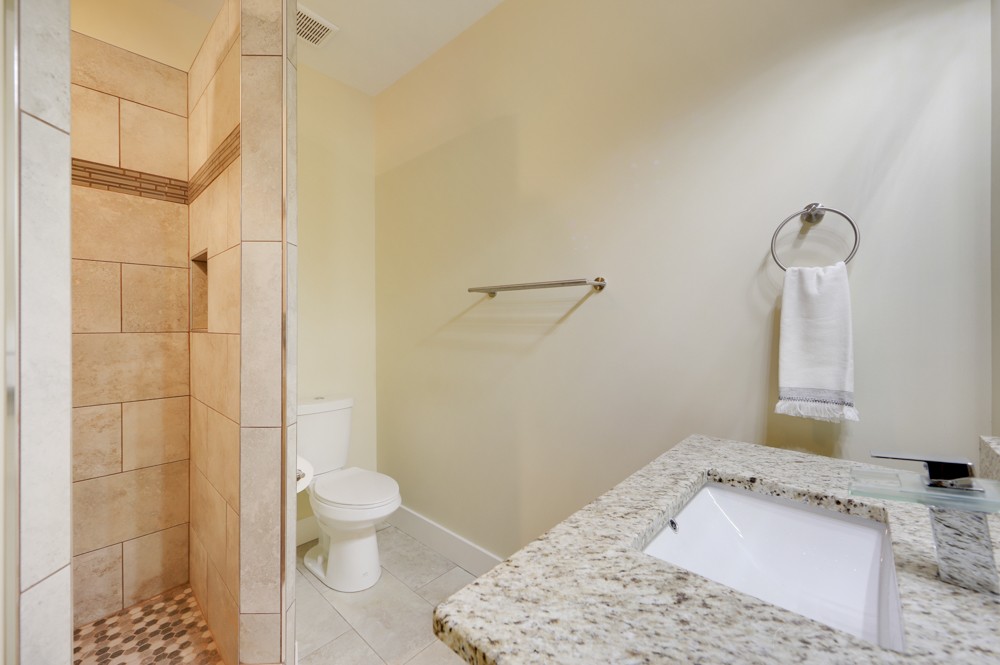 1332 B Lischey Avenue Nashville, TN 37207 - Photo 11 of 40 a bathroom with a sink toilet and shower