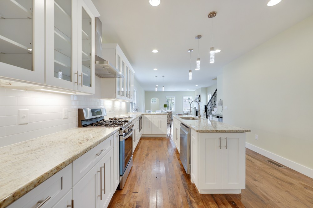 1332 B Lischey Avenue Nashville, TN 37207 - Photo 13 of 40 a kitchen with stainless steel appliances granite countertop lots of counter top and wooden floors