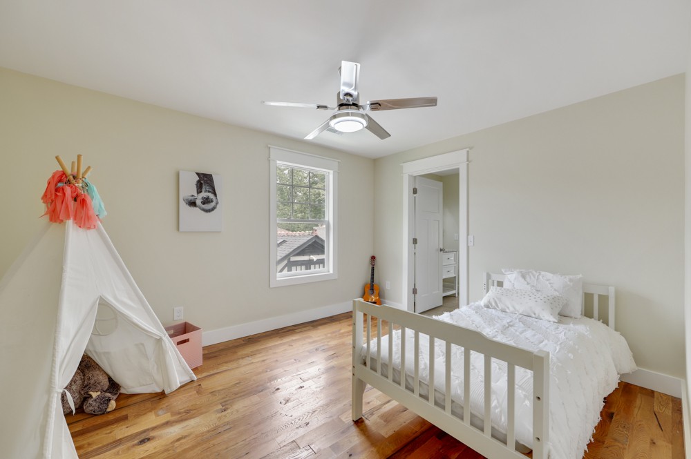 1332 B Lischey Avenue Nashville, TN 37207 - Photo 23 of 40 a bedroom with a bed and wooden floor