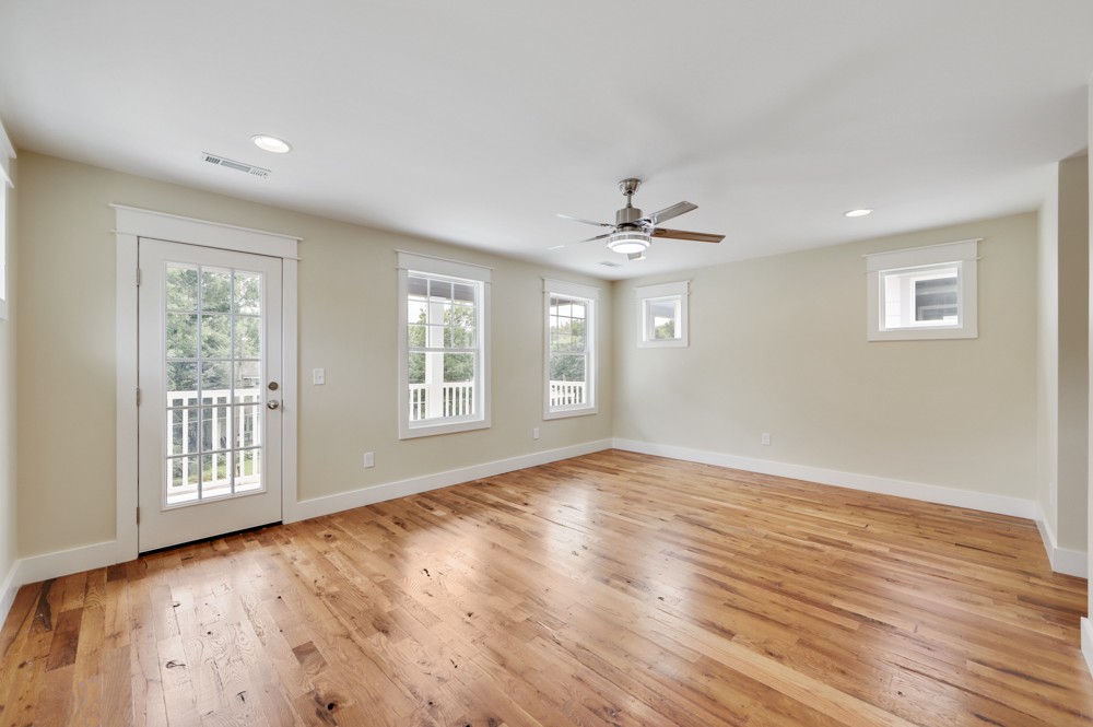 1332 B Lischey Avenue Nashville, TN 37207 - Photo 26 of 40 a view of an empty room with wooden floor and a window