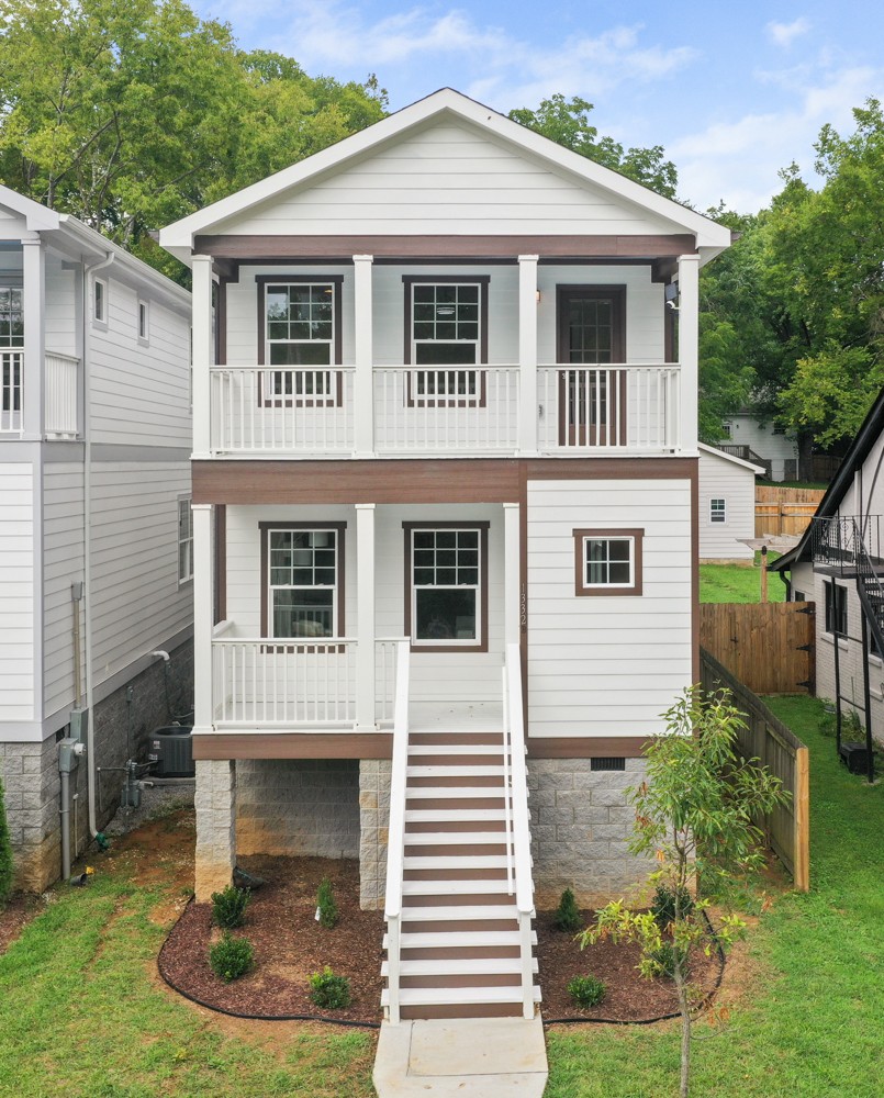 1332 B Lischey Avenue Nashville, TN 37207 - Photo 3 of 40 a front view of a house with a yard