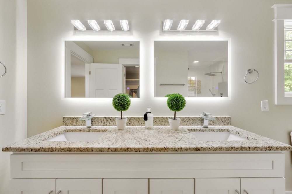 1332 B Lischey Avenue Nashville, TN 37207 - Photo 35 of 40 a bathroom with a granite countertop sink and a mirror