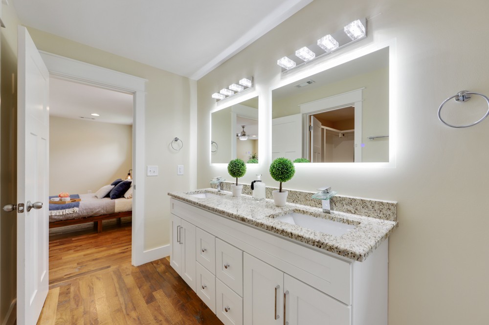 1332 B Lischey Avenue Nashville, TN 37207 - Photo 36 of 40 a en suite bathroom with a granite countertop double vanity sink and a mirror