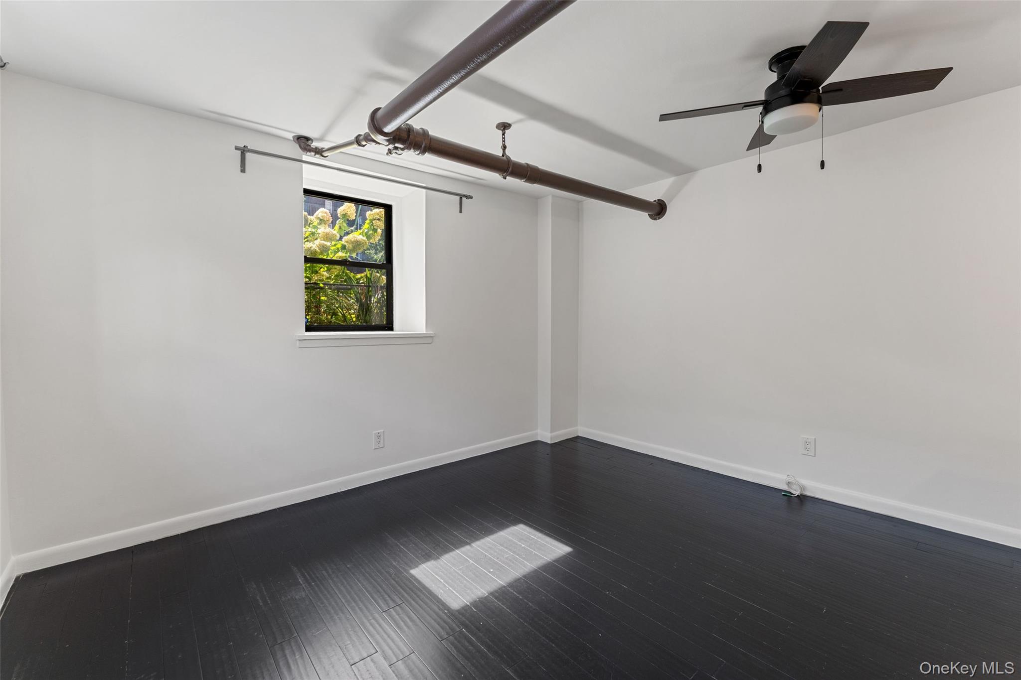 56 Pondfield Road West, Unit A Bronxville, NY 10708 - Photo 13 of 24 a view of room with a window and a ceiling fan