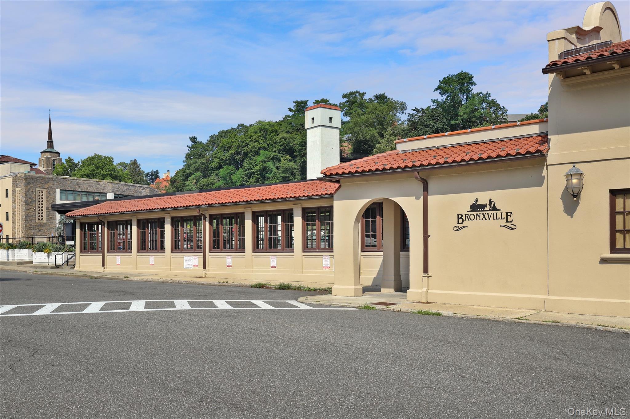 56 Pondfield Road West, Unit A Bronxville, NY 10708 - Photo 23 of 24 a front view of a house with a garden