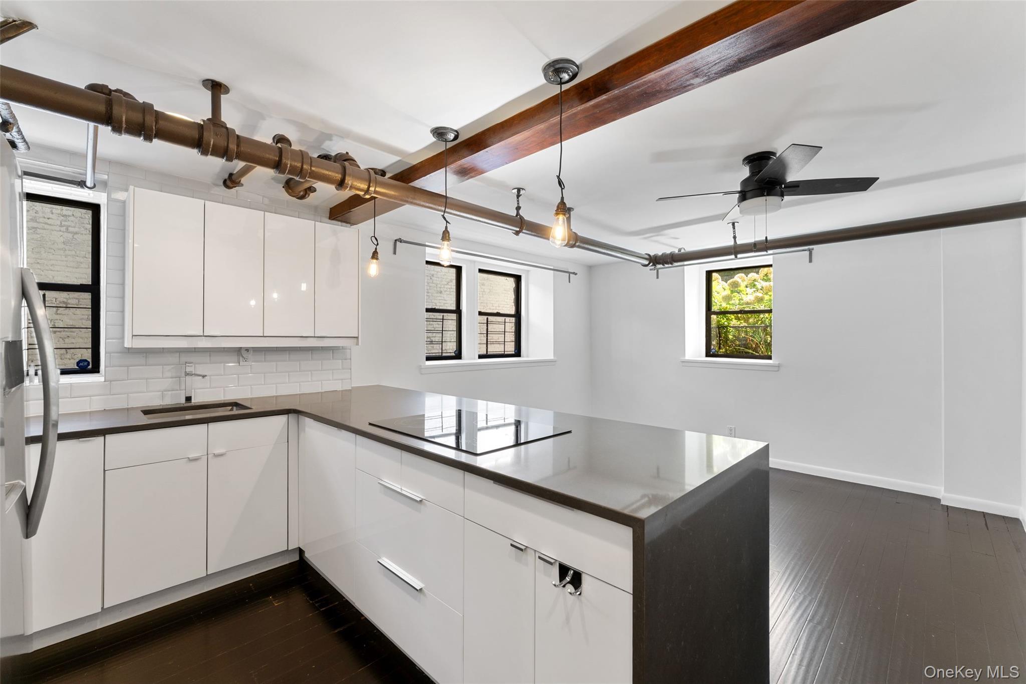 56 Pondfield Road West, Unit A Bronxville, NY 10708 - Photo 3 of 24 a kitchen with stainless steel appliances a sink and cabinets