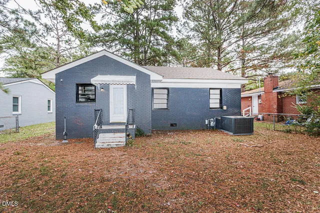 a house with trees in the background