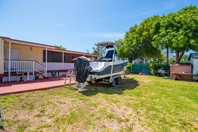a swimming pool with outdoor seating and yard