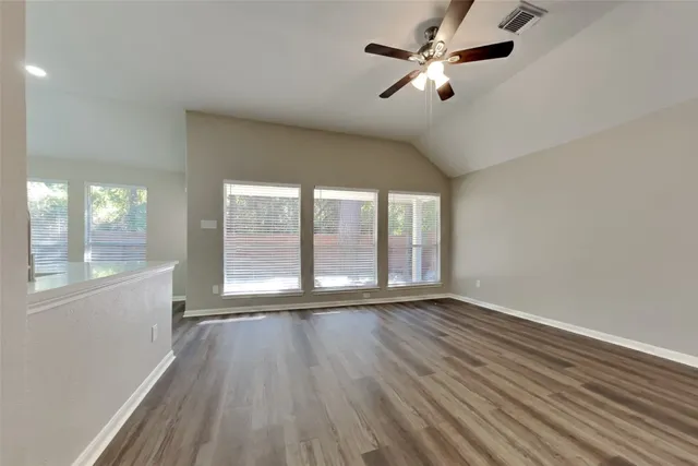 a view of room window and wooden floor