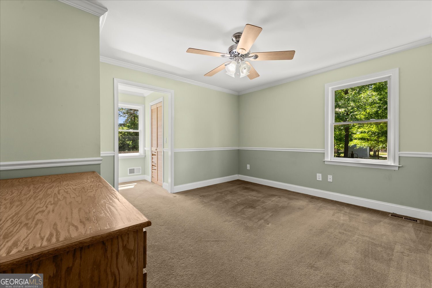 110 Riverside Drive Washington, GA 30673 - Photo 17 of 29 an empty room with windows and fan