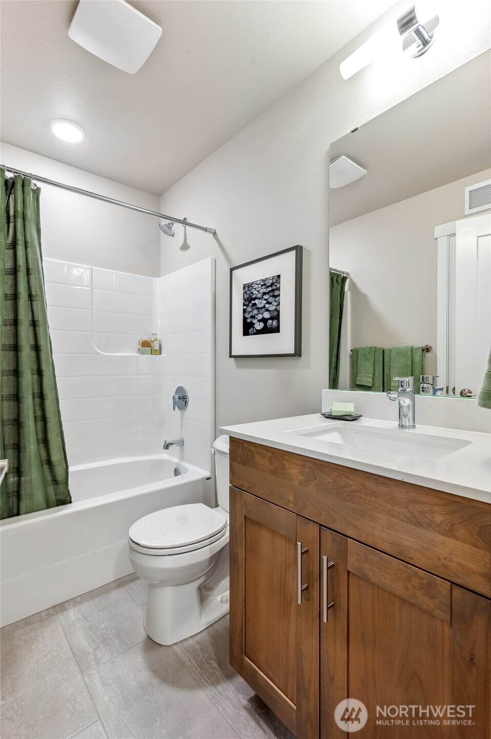 1322 194th Street Southeast, Unit H4 Bothell, WA 98012 - Photo 5 of 16 a bathroom with a granite countertop sink toilet and shower