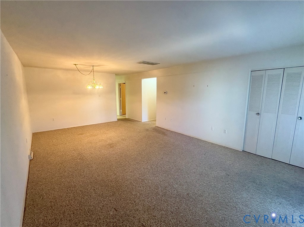 12 Snughaven Road Henrico, VA 23228 - Photo 5 of 15 Recessed lighting, textured carpeting, and bi-fold