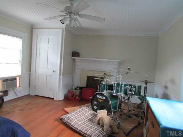 5111 Semora Road Roxboro, NC 27574 - Photo 14 of 25 a living room with furniture and a fireplace