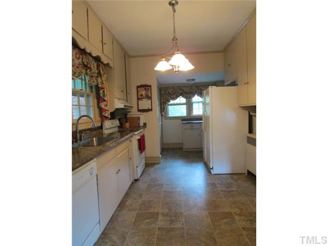5111 Semora Road Roxboro, NC 27574 - Photo 5 of 25 a large kitchen with lot of cabinets