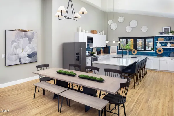 a view of a dining room with furniture and wooden floor