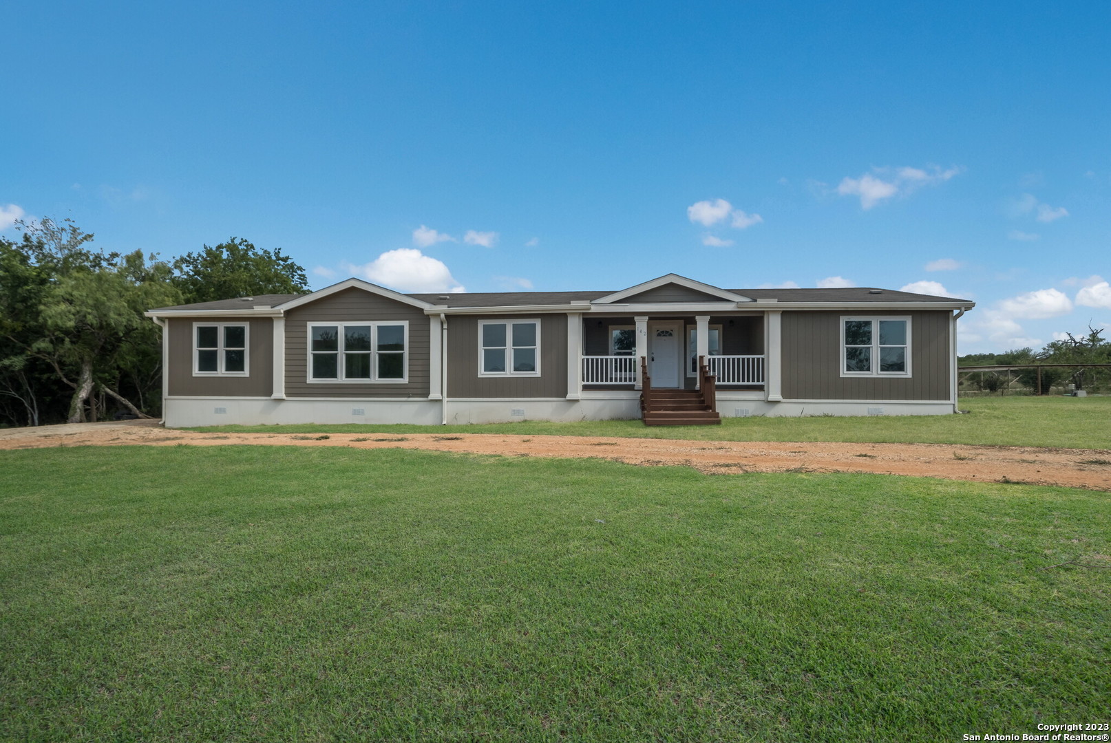 142 Andrews Avenue Marion, TX 78124 - Photo 1 of 1 a front view of a house with yard and green space