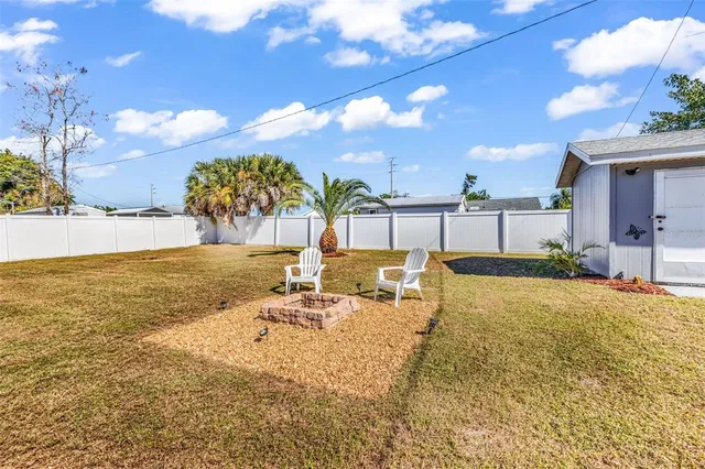 a view of a swimming pool with a lounge chair