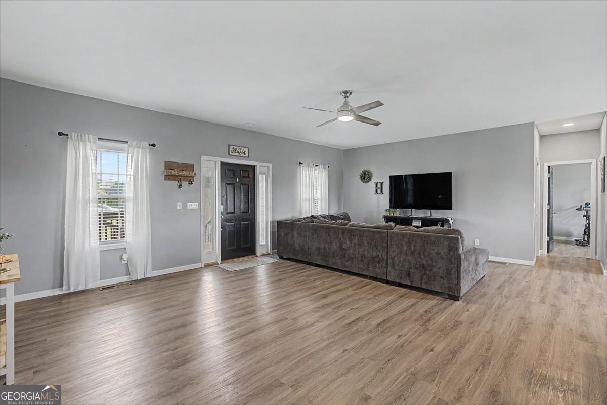 147 Edgar Bell Road Tallapoosa, GA 30176 - Photo 22 of 49 a living room with furniture and a flat screen tv