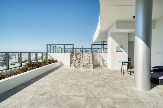 a view of a living room and balcony