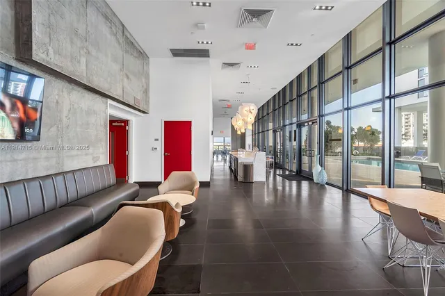 a lobby with furniture and rug
