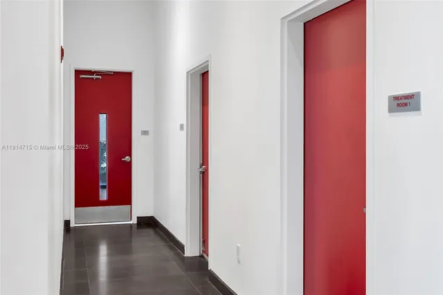 a lobby with furniture and a chandelier