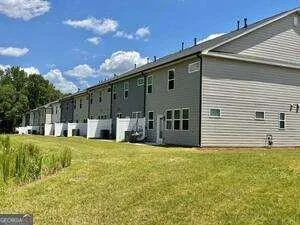 a view of a house with a big yard