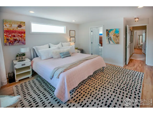 a bathroom with a sink mirror and a bathtub