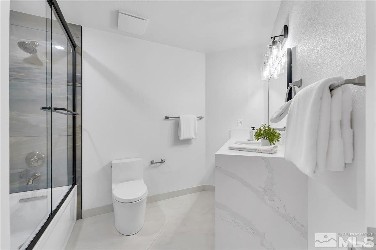 45 Water Lily Court Reno, NV 89511 - Photo 11 of 25 a bathroom with a bathtub and a shower