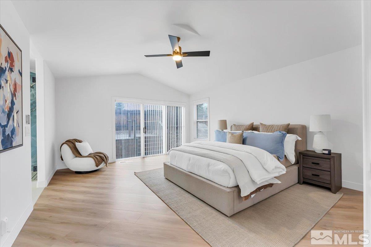 45 Water Lily Court Reno, NV 89511 - Photo 13 of 25 a spacious bedroom with a bed and window