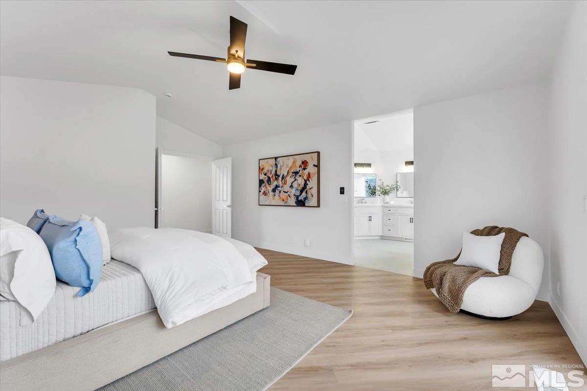 45 Water Lily Court Reno, NV 89511 - Photo 14 of 25 a bedroom with a bed and a couch