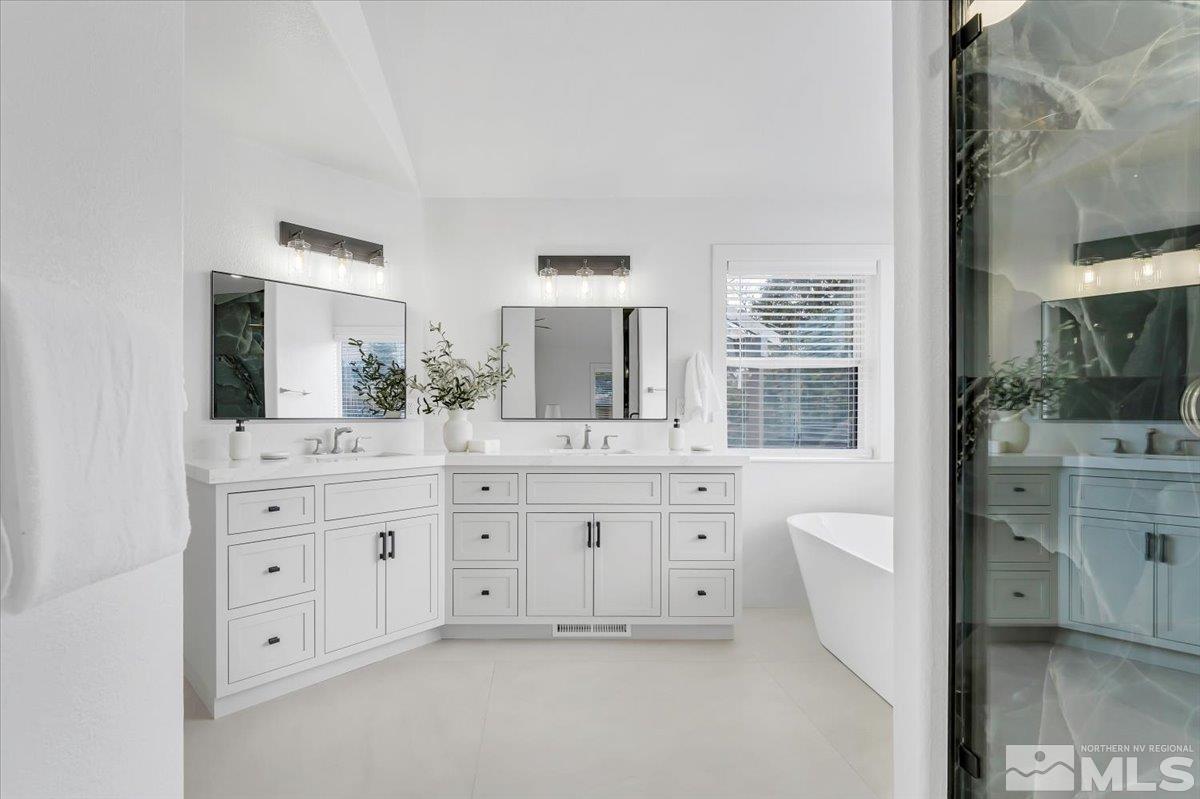 45 Water Lily Court Reno, NV 89511 - Photo 15 of 25 a spacious bathroom with a granite countertop sink mirror and bathtub