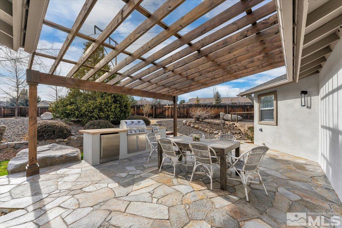 45 Water Lily Court Reno, NV 89511 - Photo 19 of 25 a view of a dinning table and chairs in the patio