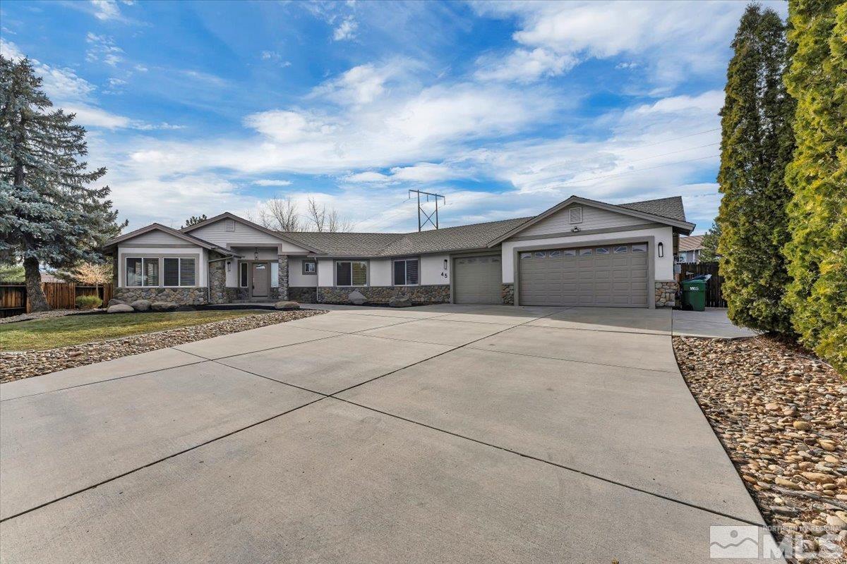 45 Water Lily Court Reno, NV 89511 - Photo 2 of 25 a front view of a house with a yard