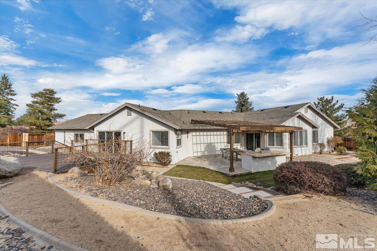 45 Water Lily Court Reno, NV 89511 - Photo 21 of 25 a front view of a house with a yard
