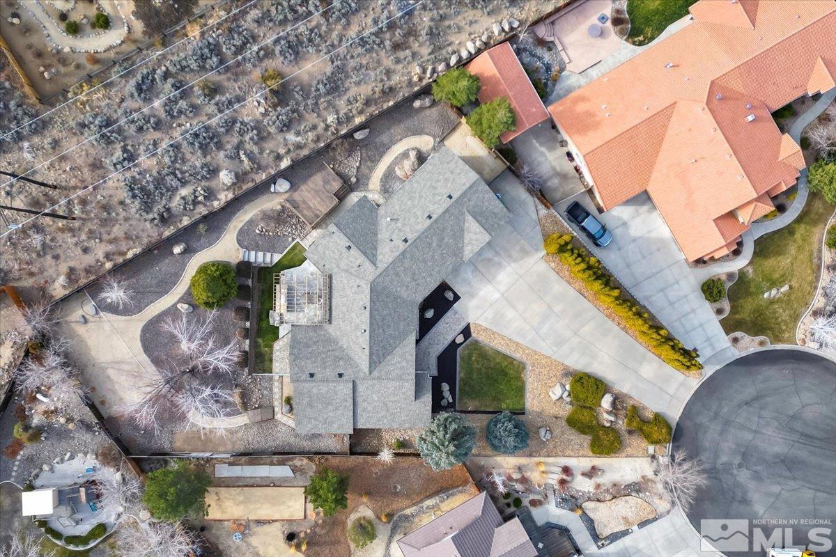 45 Water Lily Court Reno, NV 89511 - Photo 24 of 25 an aerial view of a house with a yard and a large tree