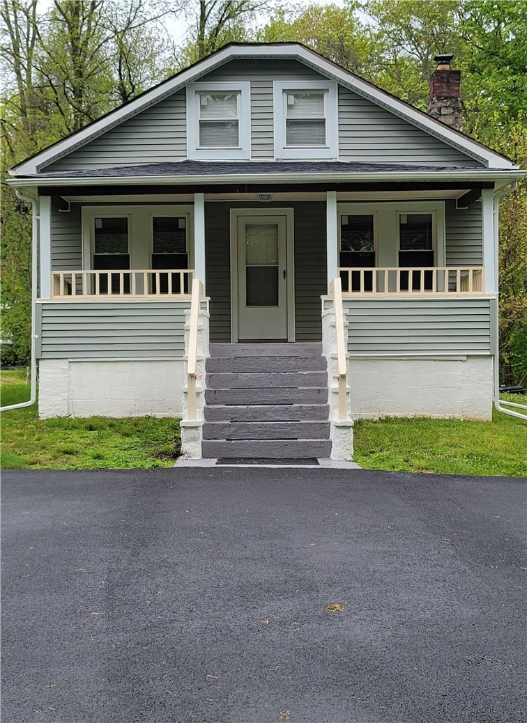 40 Decker Road Wallkill, NY 12589 - Photo 1 of 1 a front view of a house with a yard and a garage