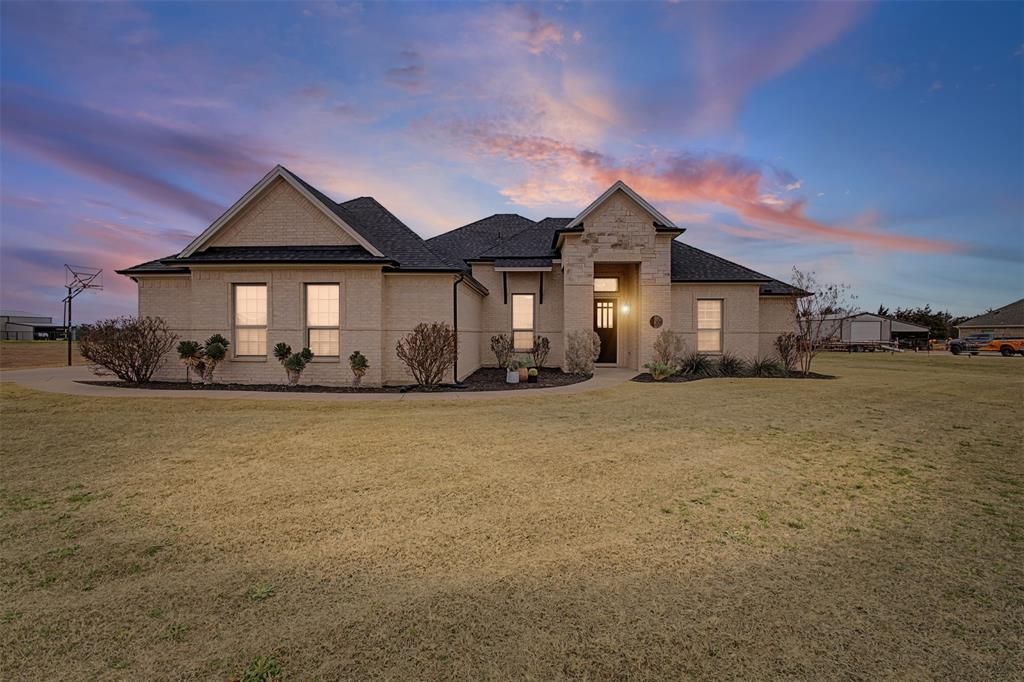 208 Blue Ridge Drive Waxahachie, TX 75167 - Photo 1 of 1 a front view of a house with a yard