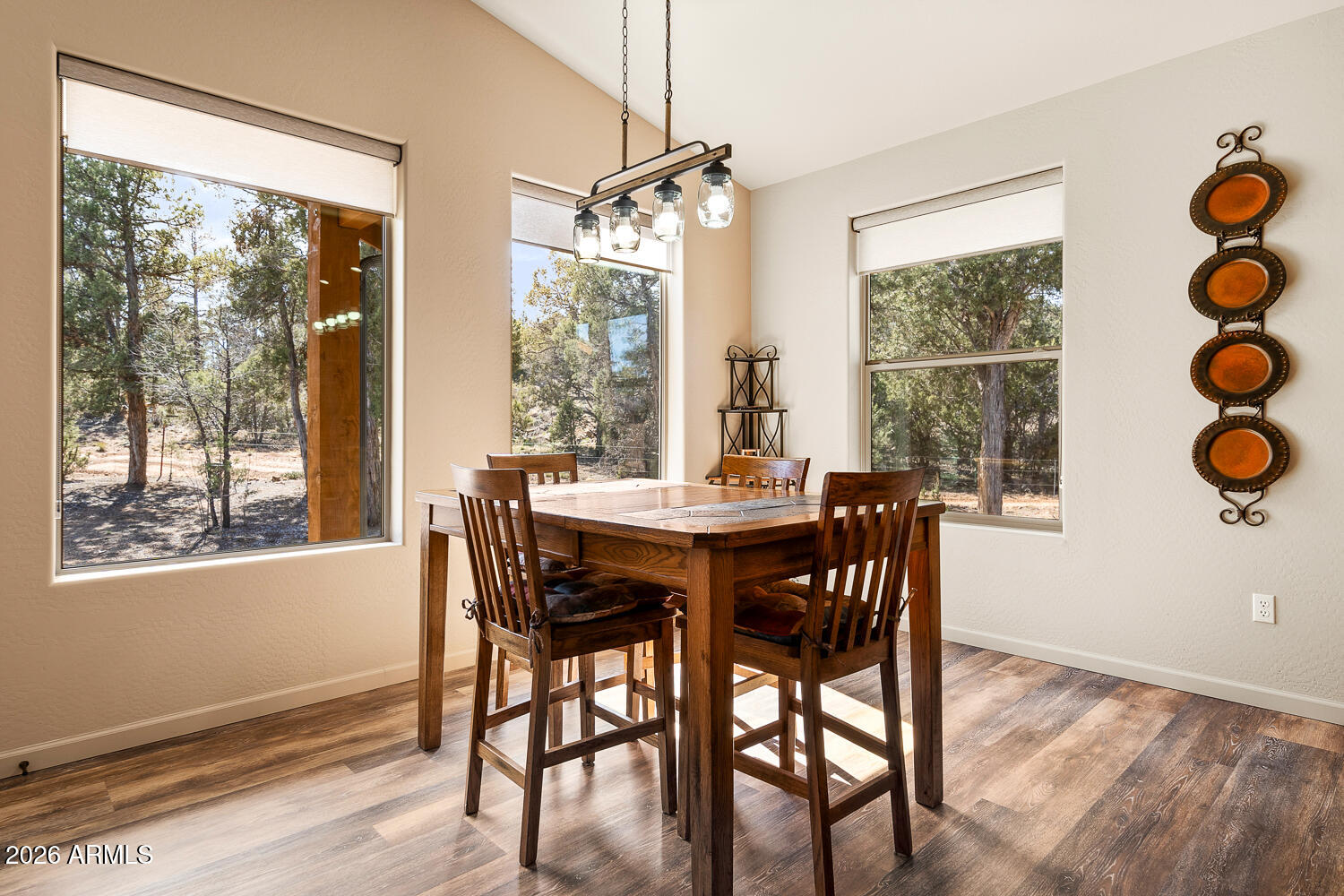 3160 North Eagle Landing Road Show Low, AZ 85901 - Photo 10 of 37 a view of a dining room with furniture wooden floor and chandelier