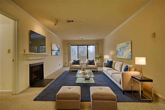 a view of an empty room with a fireplace