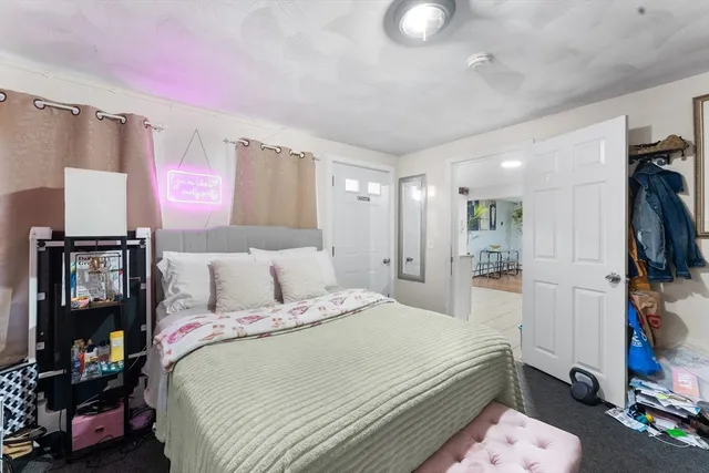 a bed room with a bed and a mirror