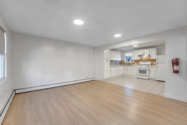 a view of a kitchen with wooden floor