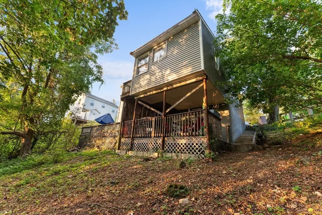 a view of a house with a tree