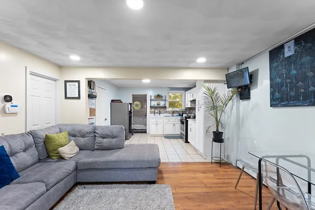 a living room with furniture and a rug